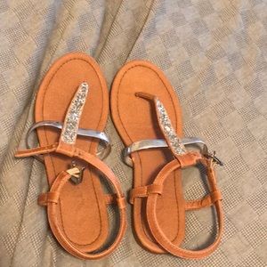 Size three brown flip-flops